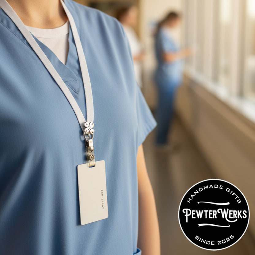 Healthcare worker wearing blue scrubs with a ID badge hanging from an eyeglass holder pinned to a lanyard. PewterWerks logo visible.