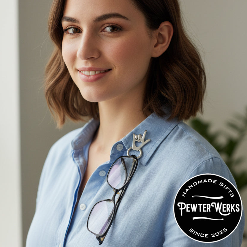 Office worker with A pair of glasses hanging from an eyeglass holder pinned to her lapel. PewterWerks logo visible.